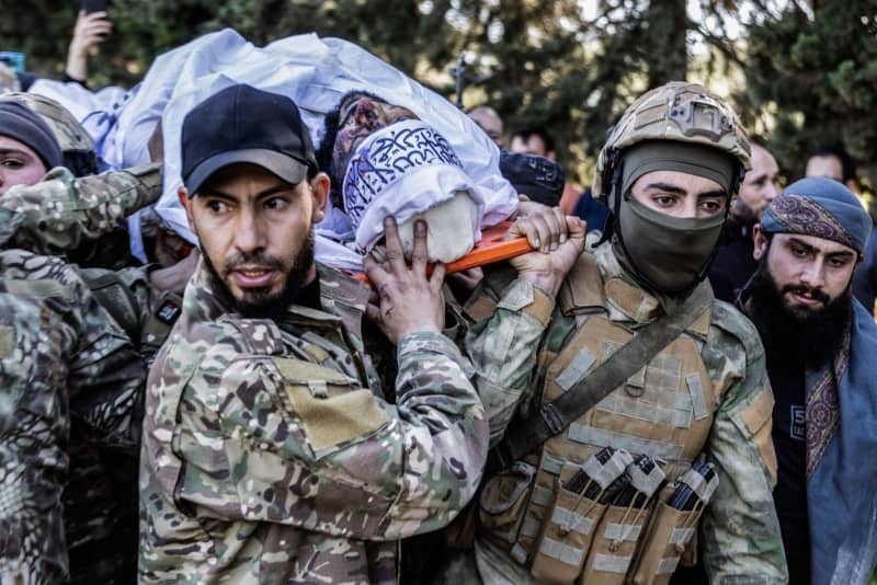 Syrians and members of Hay'at Tahrir al-Sham participate in the funeral of leader Maysar Al-Jubouri, who was killed as a result of an ISIS suicide bombing in his home in the city of Sarmada. Maysar Al-Jubouri, known as al-Qahtani, Iraqi national, one of the most prominent leaders of Hay'at Tahrir al-Sham. Anas Alkharboutli/dpa