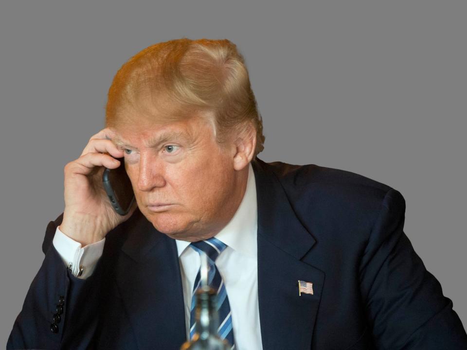 Donald Trump using phone in 2016 (AP)