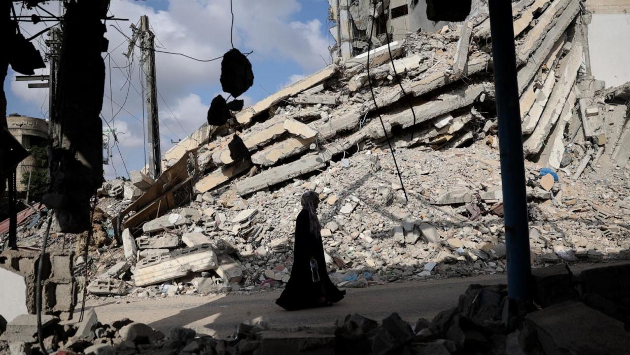 PHOTO: A Palestinian woman walks past the rubble of buildings destroyed in previous Israeli bombardments, in Rafah, in the southern Gaza Strip, Apr. 30, 2024. (AFP via Getty Images)