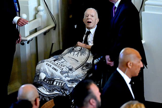 <p>ANDREW CABALLERO-REYNOLDS/AFP via Getty Images</p> Former President Jimmy Carter arrives at the tribute service for Rosalynn Carter at Glenn Memorial Church in Atlanta on Nov. 28, 2023