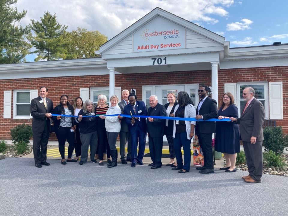 Officials and dignitaries from Easterseals, Washington County and Hagerstown line up to cut the ribbon to the new Easterseals DC MD VA Adult Day Services center at 701 E. First St. in Hagerstown.