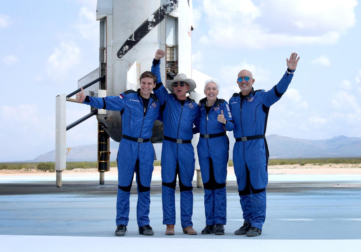 Blue Origin’s New Shepard crew (L-R) Oliver Daemen, Jeff Bezos, Wally Funk and Mark Bezos pose for a picture after flying into space in the Blue Origin New Shepard in Van Horn, Texas (Getty Images)