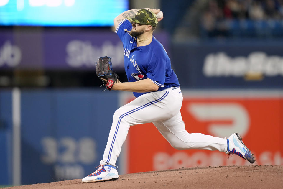 Toronto Blue Jays starting pitcher Alek Manoah (6) works against the Cincinnati Reds during the first inning of a baseball game in Toronto, Saturday, May 21, 2022. (Frank Gunn/The Canadian Press via AP)