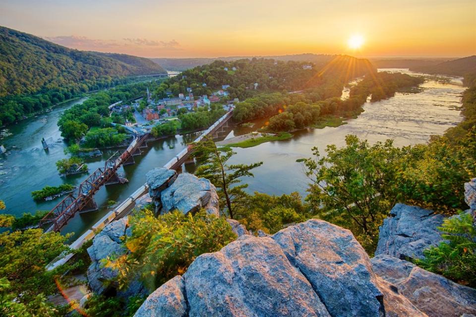 The sun sets on a warm summer day over Harpers Ferry via Getty Images