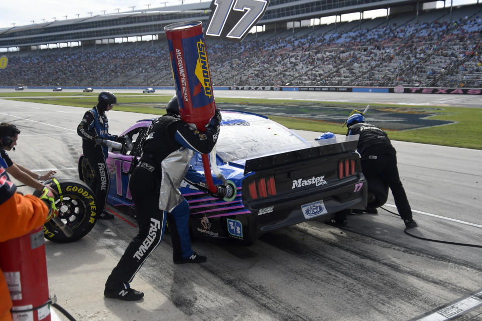 Chris Buescher (17) makes a pitstop during a NASCAR Cup Series auto race at Texas Motor Speedway Sunday, Oct. 17, 2021, in Fort Worth, Texas. (AP Photo/Randy Holt)