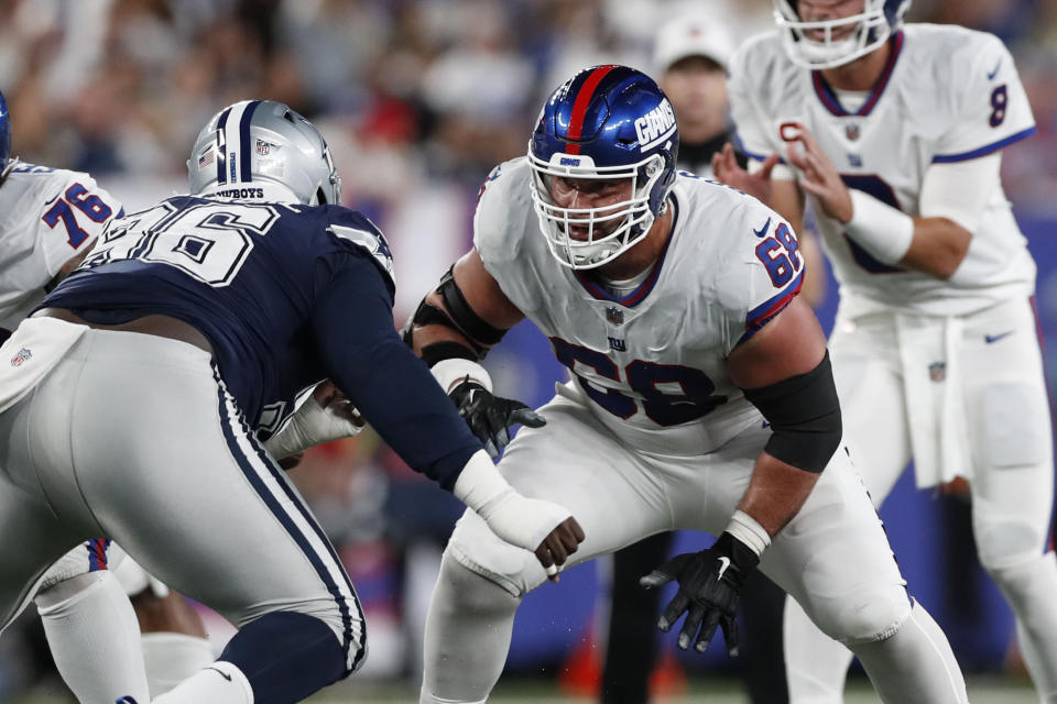 FILE - New York Giants guard Ben Bredeson (68) moves in to block Dallas Cowboys defensive tackle Neville Gallimore (96) during an NFL football game, Monday, Sept. 26, 2022, in East Rutherford, N.J. Since the Giants opened training camp in late July, Bredeson has played center, left guard and right guard.(AP Photo/Steve Luciano, File)