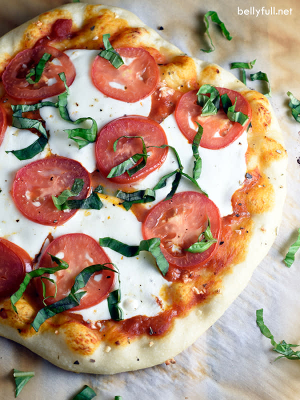 <p>Belly Full</p><p>Made with fresh marinara sauce, mozzarella cheese, basil and fresh tomatoes, this classic Margherita pizza is simple, classic, and absolutely delicious! </p><p><strong>Get the recipe: <a href="http://bellyfull.net/2016/03/10/classic-margherita-pizza/" rel="nofollow noopener" target="_blank" data-ylk="slk:Classic Margherita Pizza;elm:context_link;itc:0;sec:content-canvas" class="link rapid-noclick-resp">Classic Margherita Pizza</a></strong></p>