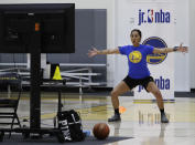 In this photo taken on Tuesday, June 9, 2020, coach Chanel Antonio leads a drill with her virtual students at Golden State Warriors basketball camp in Oakland, Calif. The Warriors had to adapt their popular youth basketball camps and make them virtual given the COVID-19 pandemic. (AP Photo/Ben Margot)