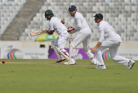 Cricket - Bangladesh v England - Second Test cricket match - Sher-e-Bangla Stadium, Dhaka, Bangladesh - 28/10/16. Bangladesh's Tamim Iqbal (L) watches the ball after playing a shot. REUTERS/Mohammad Ponir Hossain