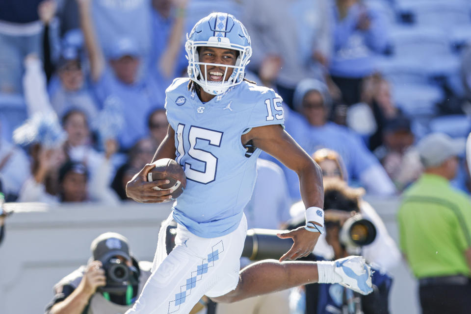 North Carolina quarterback Conner Harrell runs for a touchdown against Campbell in the second half of an NCAA college football game in Chapel Hill, N.C., Saturday, Nov. 4, 2023. North Carolina won 59-7. (AP Photo/Nell Redmond)