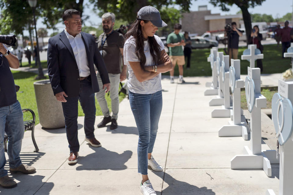 Meghan Markle, Duchess of Sussex, visits a memorial site, Thursday, May 26, 2022, honoring the victims killed in Tuesday's elementary school shooting in Uvalde, Texas,. (AP Photo/Jae C. Hong)