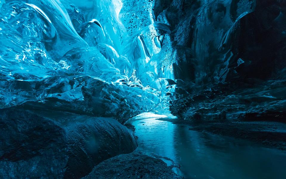 An ice cave at the Vatnajökull glacier - Credit: AP