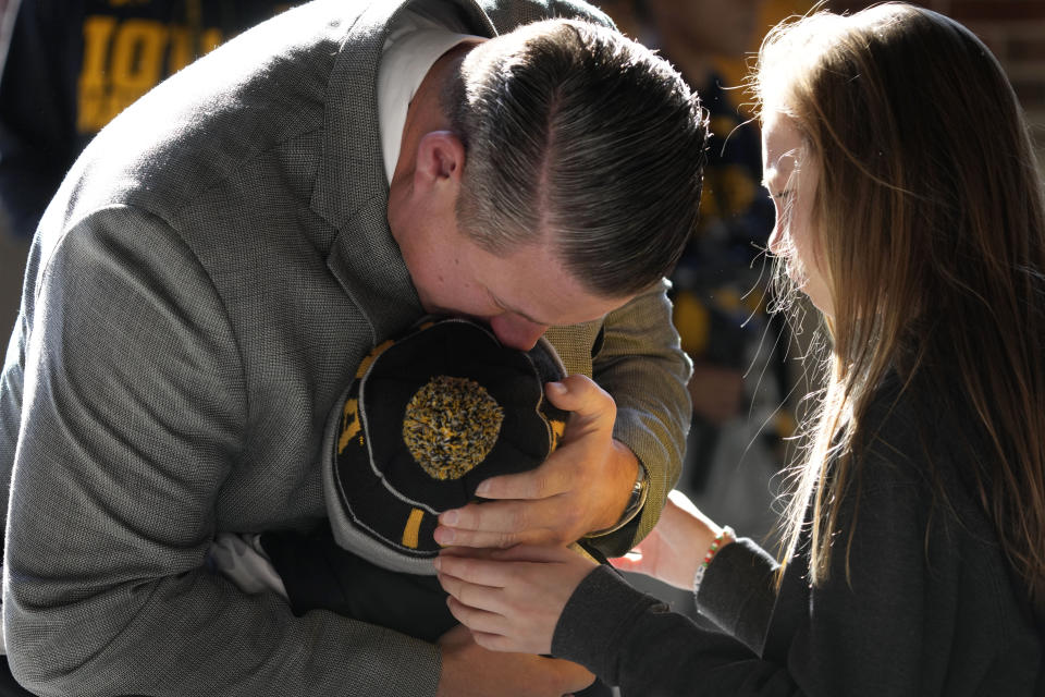 Iowa offensive coordinator Brian Ferentz is greeted by family members as he arrives at Kinnick Stadium before an NCAA college football game against Illinois, Saturday, Nov. 18, 2023, in Iowa City, Iowa. Iowa interim athletics director Beth Goetz announced in late October that Ferentz would not return next season as the Hawkeyes' offensive coordinator. (AP Photo/Charlie Neibergall)