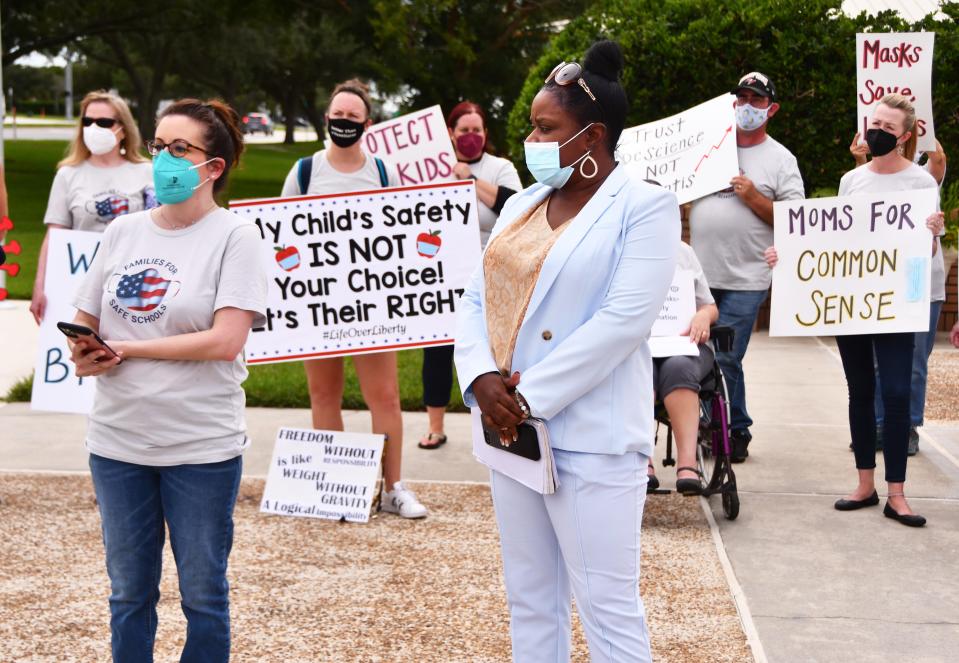 In an August 2021 photo, Eli Logan, left, a nurse practitioner, and Tamika Lyles, founder of Standing Heroes For Average Workers, SHAW, show up at a Brevard County school board meeting  in favor of mask-wearing in Brevard Public Schools.