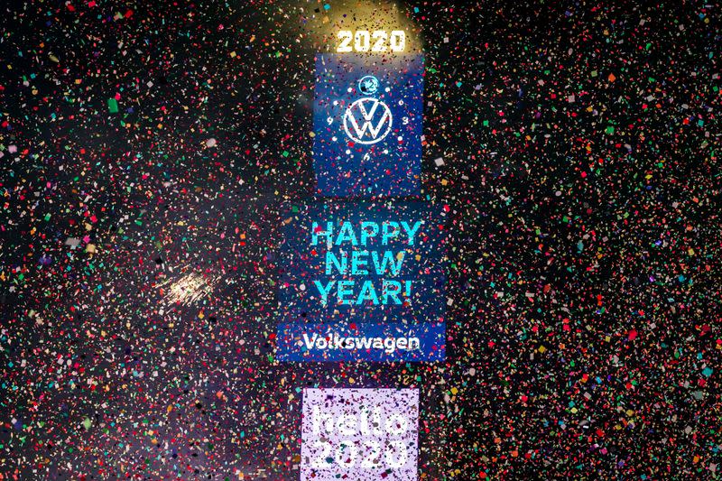 FILE PHOTO: Confetti flies around the ball and countdown clock in Times Square in the Manhattan borough of New York