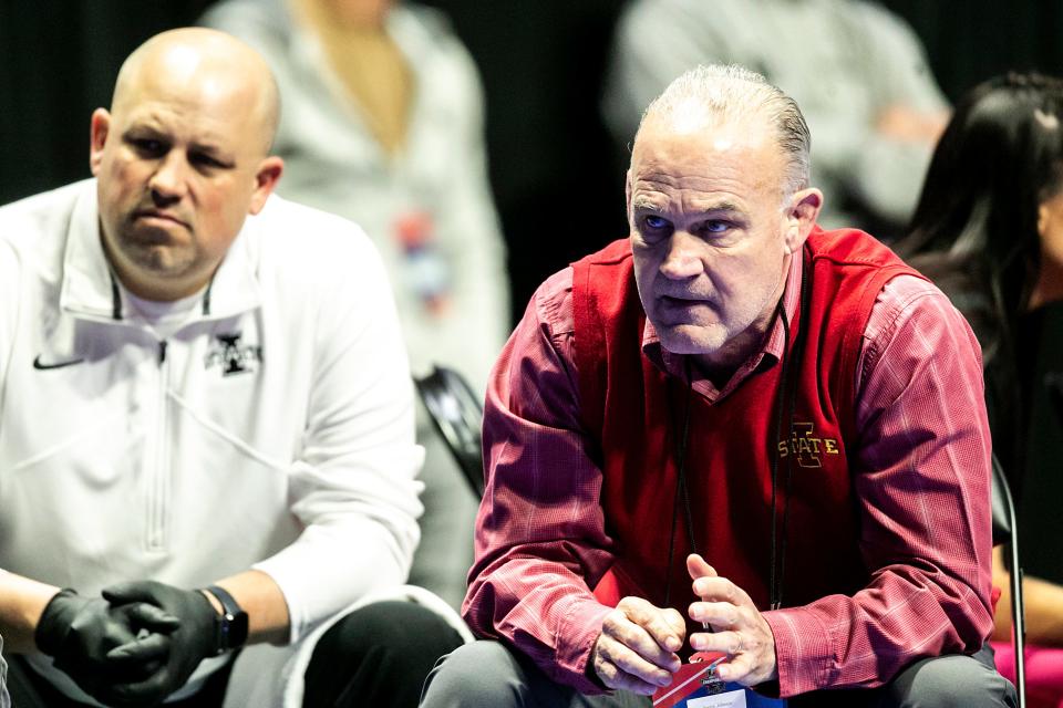 Iowa State's Kevin Dresser, right, watches during the third session of the NCAA Division I Wrestling Championships this year.