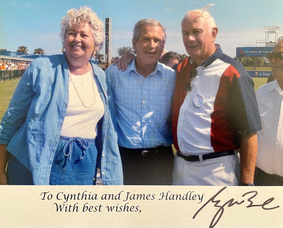 President George W. Bush autographed this photo to Cynthia and Jim Handley after they were pictured together during his October 2004 campaign rally at Space Coast Stadium in Viera.
