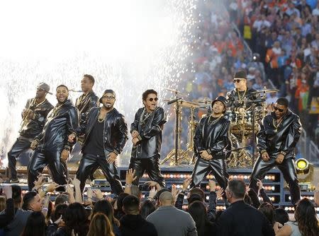 Bruno Mars (C, in sunglasses) performs during half-time at the NFL's Super Bowl 50 football game between the Carolina Panthers and the Denver Broncos in Santa Clara, California February 7, 2016. REUTERS/Mike Blake