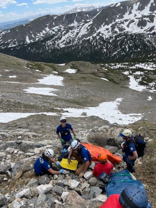 Rescue crews on a mountain peak