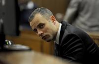 Oscar Pistorius sits in court for his ongoing murder trial in Pretoria, South Africa, Monday, May 12, 2014. Pistorius is charged with the shooting death of his girlfriend Reeva Steenkamp on Valentine's Day in 2013. (AP Photo/Chris Collingridge, Pool)