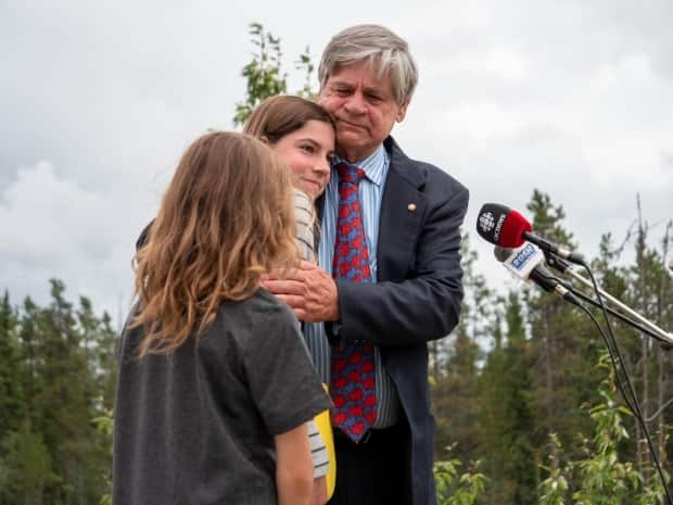 Long-time Yukon MP Larry Bagnell with his kids on Thursday as he announced he wouldn't run in the next federal election. He ran in seven federal campaigns, winning all but one. (Vincent Bonnay/Radio-Canada - image credit)