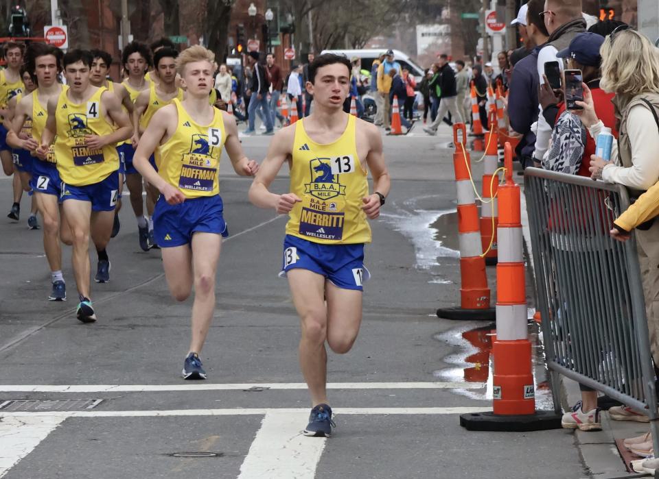 Wellesley's Eli Merritt leads the pack while taking the turn onto Boylston Street in the BAA Boys Invitational Mile on Saturday, April 13, 2024 in Boston. Behind him are Wellesley's Max Hoffman (No. 5) and Natick's Sean Fleming (No. 4).