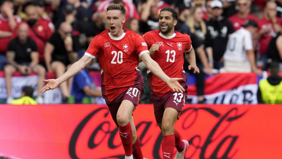 Michel Aebischer celebrates after scoring Switzerland's second goal. - Darko Vojinovic/AP