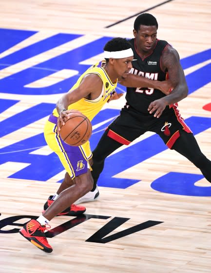 ORLANDO, FLORIDA SEPTEMBER 30, 2020-Lakers Rajopn Rondo dribbles past a Heat.