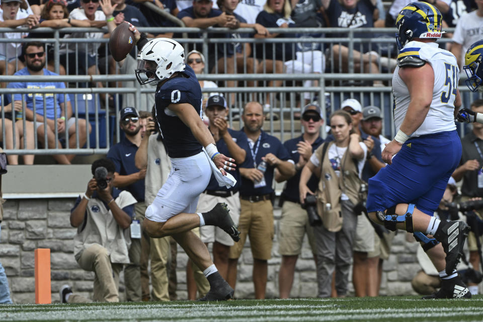 Penn State linebacker Dominic DeLuca (34) returns an interception for a touchdown against Delaware on Saturday, Sept. 9, 2023, in State College, Pa. (AP Photo/Barry Reeger)