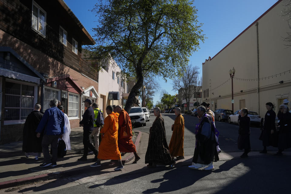 Buddhist faith leaders and community members participate in a "May We Gather" pilgrimage, Saturday, March 16, 2024, in Antioch, Calif. The event aimed to use karmic cleansing through chants, prayer and testimony to heal racial trauma caused by anti-Chinese discrimination in Antioch in the 1870s. (AP Photo/Godofredo A. Vasquez)