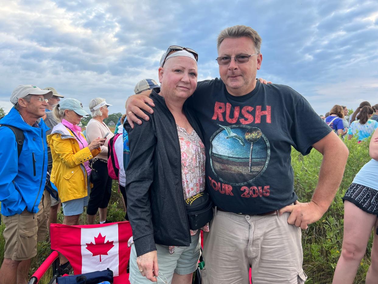 Brandy Farrell, 55, and Doug Farrell, 55, came to Chincoteague Pony Swim Wednesday from Canada. They intended to come in 2020 but the pandemic and closed border forced their trip to be cancelled.