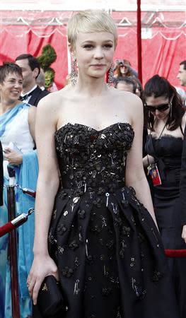 Carey Mulligan, best actress nominee for "An Education," arrives in a black embellished Prada dress at the 82nd Academy Awards in Hollywood in this March 7, 2010 file photo. REUTERS/Mario Anzuon/Files