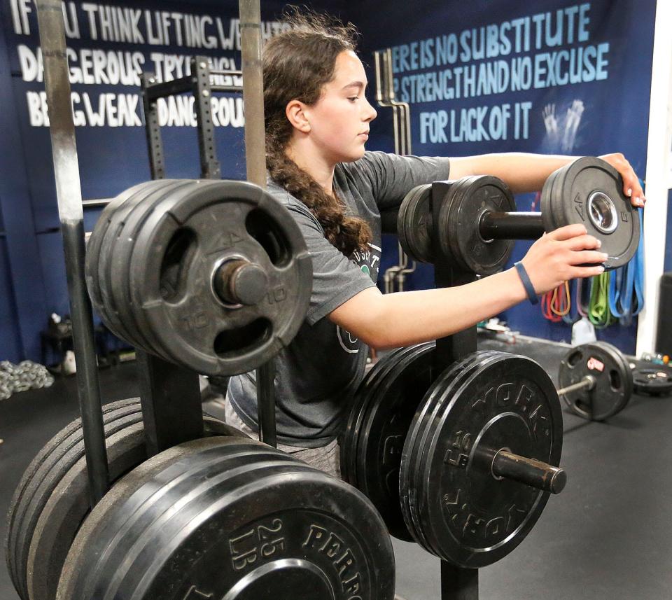 Braintree High sophomore lacrosse player Bella Duffy moonlights as a powerlifter. She has deadlifted 330 pounds. She works out at Atlantic Sports Performance in Hanover on Friday, April 28, 2023.