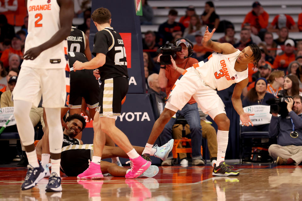 Judah Mintz of the Syracuse Orange reacts after being shoved by Doug Edert of the Bryant University Bulldogs