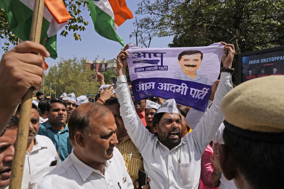 Members of Aam Admi Party, or Common Man's Party, shout slogans during a protest against the arrest of their party leader Arvind Kejriwal in New Delhi, India, Tuesday, March 26, 2024. Indian police have detained dozens of opposition protesters and prevented them from marching to Prime Minister Narendra Modi’s residence to demand the release of their leader and top elected official of New Delhi who was arrested last week in a liquor bribery case. (AP Photo/Manish Swarup)