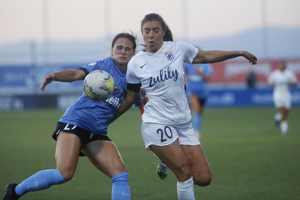 Chicago Red Stars' Bianca St. Georges, left, and Reign's Sofia Huerta (20) battle for the ball during the first half of an NWSL Challenge Cup soccer match at Zions Bank Stadium, Saturday, July 18, 2020, in Herriman, Utah. (AP Photo/Rick Bowmer)