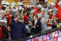 MIAMI, FLORIDA - FEBRUARY 02: Kansas City Chiefs owner and CEO Clark Hunt raises the Vince Lombardi Trophy after they defeated the San Francisco 49ers 31-20 in Super Bowl LIV at Hard Rock Stadium on February 02, 2020 in Miami, Florida. (Photo by Elsa/Getty Images)