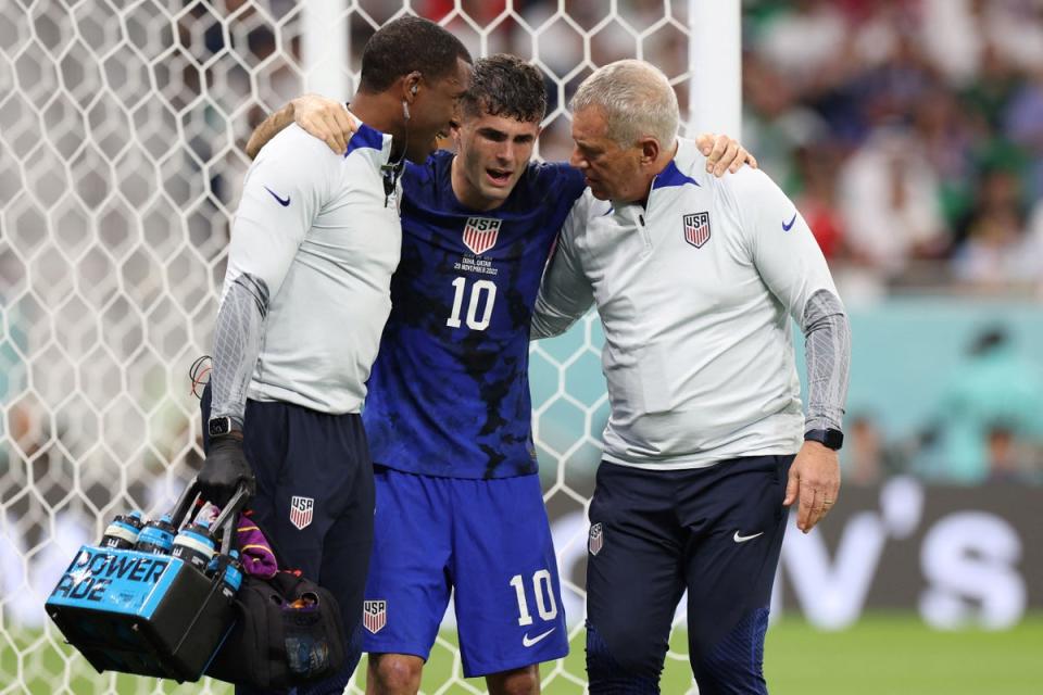 Christian Pulisic injured his abdominal in the process of scoring USA’s goal against Iran (AFP via Getty Images)