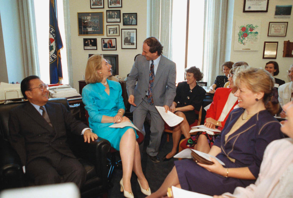 First lady Hillary Rodham Clinton shares a laugh with senators on Capitol Hill, May 6, 1993.