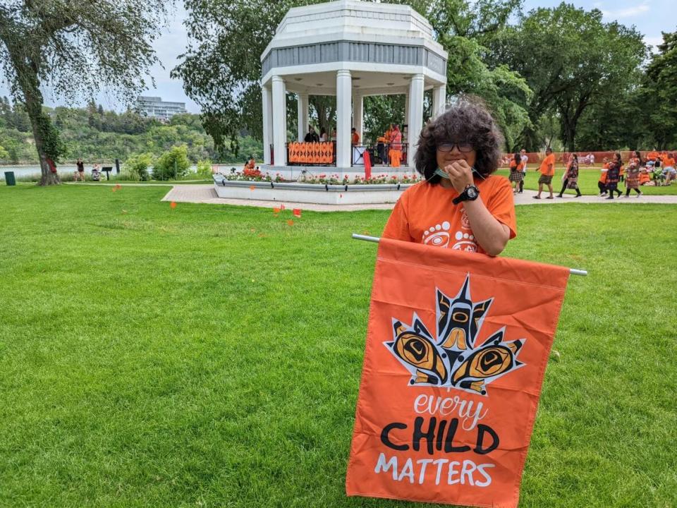 One of the attendees who showed up at the start of the Cancel Canada Day event at  Kiwanis Memorial Park in Saskatoon on Friday. Several hundred people attended the event, an alternative to Canada Day celebrations. (Dayne Patterson/CBC - image credit)