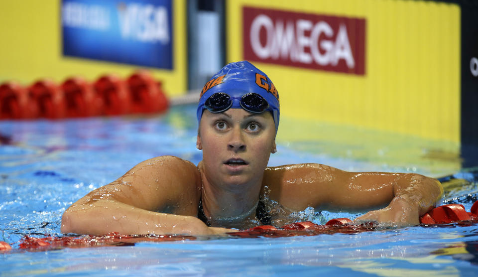 FILE - In this June 27, 2012 file photo, Elizabeth Beisel looks on after swimming in the women's 200-meter individual medley preliminaries at the U.S. Olympic swimming trials in Omaha, Neb. Beisel competed in three Olympics, but she's never taken on a challenge quite like this. Honoring her late father and raising money for cancer research, she's planning to swim more than 12 miles through cold ocean waters to a popular vacation island off the Rhode Island coast. (AP Photo/Mark Humphrey, File)