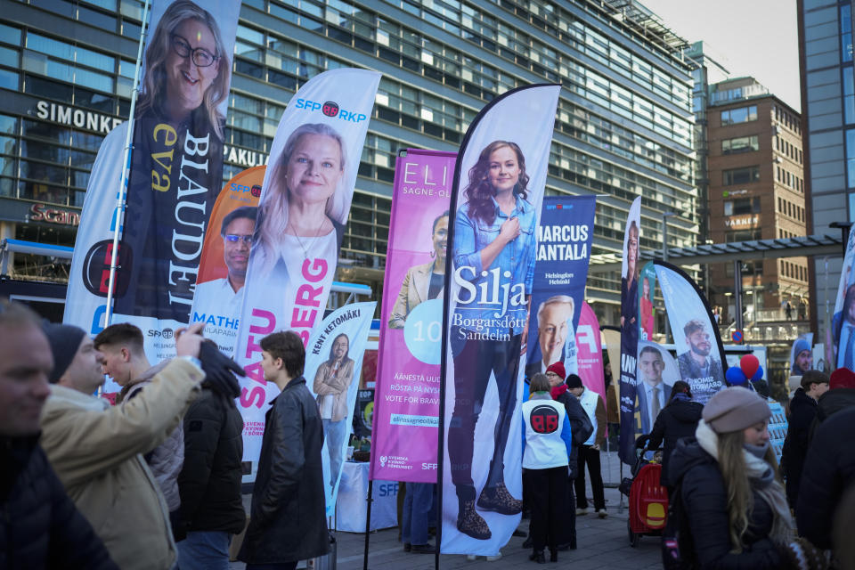 Election posters are seen in Helsinki, Finland, Saturday, April 1, 2023. A parliamentary election in Finland on Sunday is shaping up as an extremely close race between three parties as Prime Minister Sanna Marin's Social Democrats fight to secure a second term running the government. (AP Photo/Sergei Grits)
