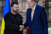 Turkish President Recep Tayyip Erdogan, right, shakes hands with Ukrainian President Volodymyr Zelenskyy at the end of a join news conference following their meeting at Dolmabahce palace in Istanbul, Turkey, Friday, March 8, 2024. (AP Photo/Francisco Seco)