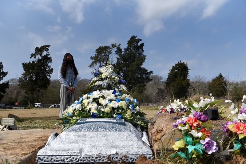 The Wider Image: 'I just ask God to help me': Texas funeral home crushed by death as U.S. COVID toll nears 500,000