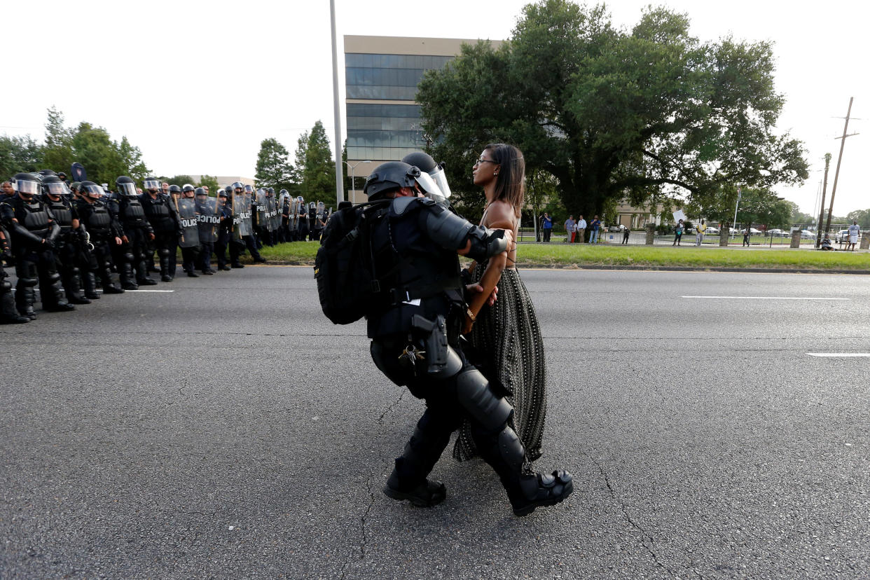 Protestor Ieshia Evans is detained by law enforcement near the headquarters of the Baton Rouge Police Department in Baton Rouge, Louisiana, U.S. July 9, 2016.    REUTERS/Jonathan Bachman     SEARCH "#BLACK LIVES MATTER" FOR THIS STORY. SEARCH "THE WIDER IMAGE" FOR ALL STORIES. 
