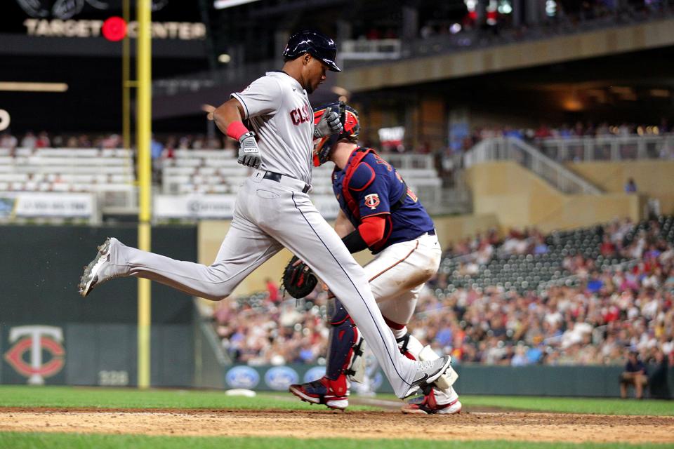 Guardians rookie outfielder Oscar Gonzalez scores the go-ahead run on a sacrifice fly by Owen Miller in the ninth inning of an 11-10 win over the Minnesota Twins. [Andy Clayton-King/Associated Press]