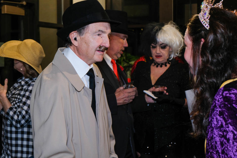 A costumed detective inquires about the festivities at the Amarillo Botanical Gardens' first annual Halloween Ball, Saturday, Oct. 30.