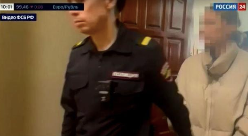 A screengrab from a video aired on Feb. 20, 2024 by Russia’s state-run broadcaster RU24 shows an LA woman being arrested and taken to court in Russia (RU24)