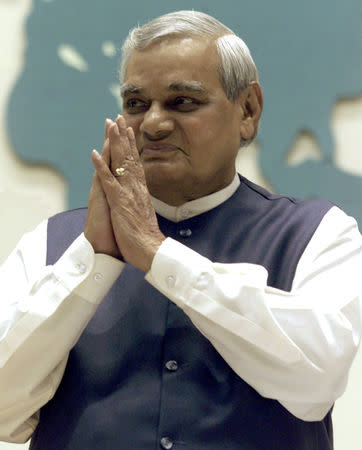 FILE PHOTO: Indian Prime Minister Atal Bihari Vajpayee folds his hands in a traditional Indian style of greeting upon the start of the inauguration of the 73rd Annual Session of the FICCI (Federation of Indian Chambers of Commerce and Industry) gathering in New Delhi, India December 16, 2000. REUTERS/Kamal Kishore/File Photo