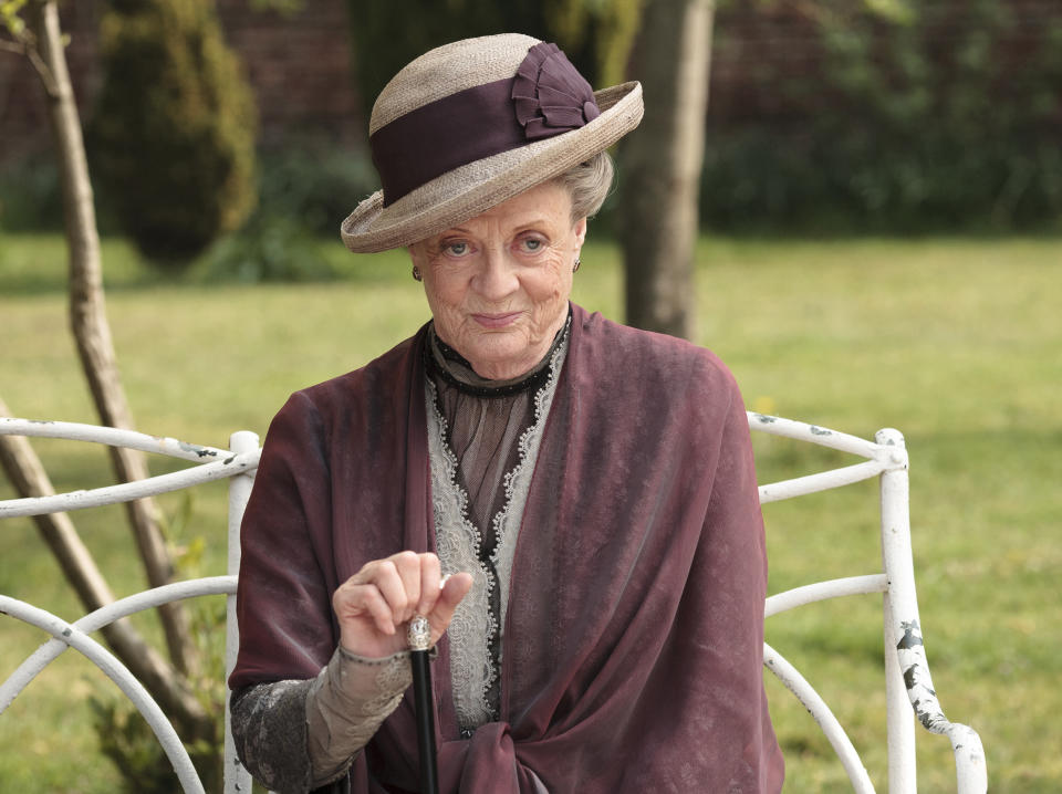 This image released by PBS shows Maggie Smith as the Dowager Countess Grantham in a scene from the second season on "Downton Abbey." The countess was witty, sarcastic and dryly resigned over all six of the show’s seasons. She made chilly and imperious somehow hysterical. "Don't be defeatist dear,” she once counseled. “It's very middle class." (AP Photo/PBS, Carnival Film & Television Limited 2011 for MASTERPIECE, Nick Briggs)